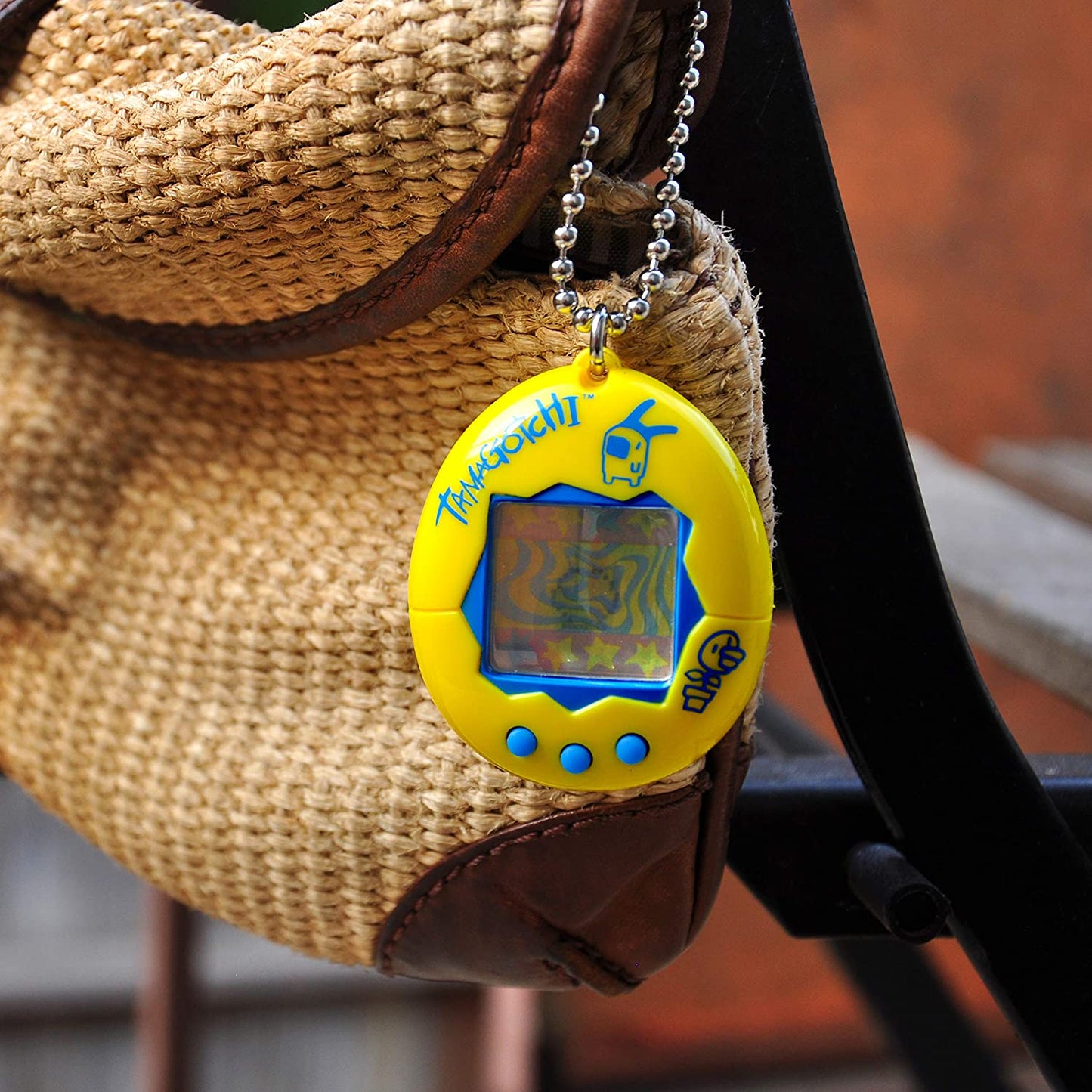 Tamagotchi electronic game, yellow / blue